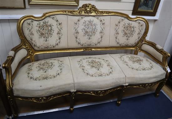 A Louis XV style gilt carved wood settee, on cabriole legs W.173cm